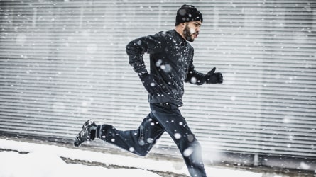 Athlete running in the snow