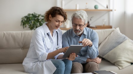 Doctor and patient looking at schedule on an iPad