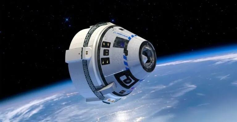 NASA Starliner space taxi in space, orbiting Earth.